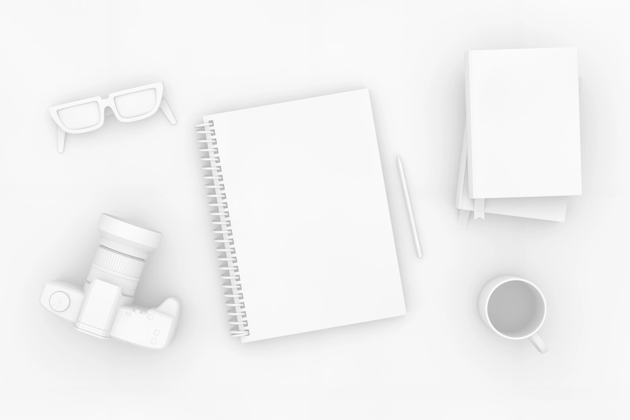 Minimal desktop flatlay with notebook and books